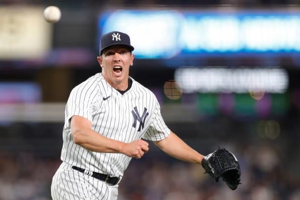 Chad Green of the New York Yankees reacts as he throws to first for an out during the eighth inning against the Los Angeles Angels at Yankee Stadium...