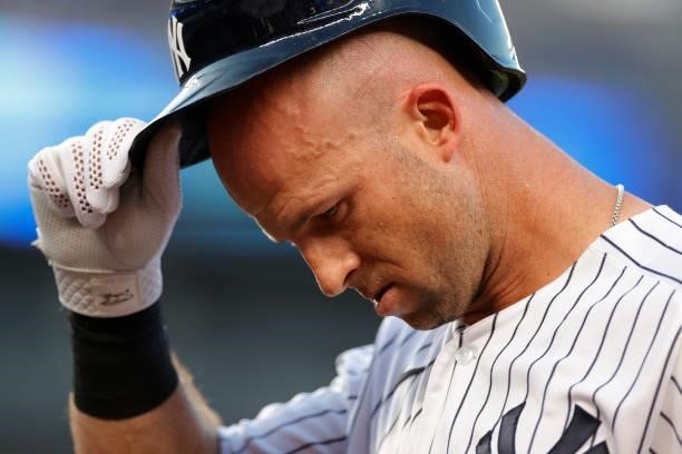 Brett Gardner of the New York Yankees removes his helmet during the second inning against the Los Angeles Angels at Yankee Stadium on June 28, 2021...