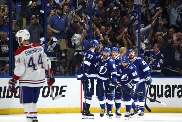 Steven Stamkos of the Tampa Bay Lightning celebrates his power play goal against the Montreal Canadiens with teammates in the third period of Game...