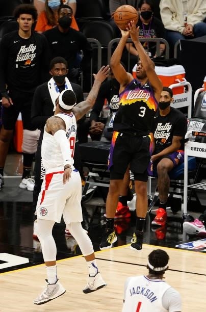 Chris Paul of the Phoenix Suns shoots against Marcus Morris Sr. #8 of the LA Clippers during the second half in Game Five of the Western Conference...