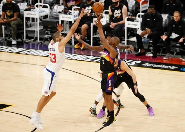 Chris Paul of the Phoenix Suns is defended by Nicolas Batum of the LA Clippers during the second half in Game Five of the Western Conference Finals...