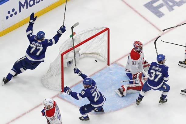Yanni Gourde of the Tampa Bay Lightning scores a goal past Carey Price of the Montreal Canadiens during the second period in Game One of the 2021 NHL...