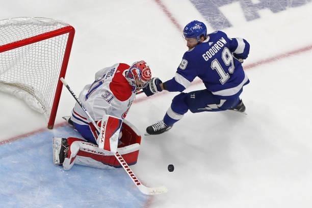 Carey Price of the Montreal Canadiens makes the save against Barclay Goodrow of the Tampa Bay Lightning during the second period in Game One of the...