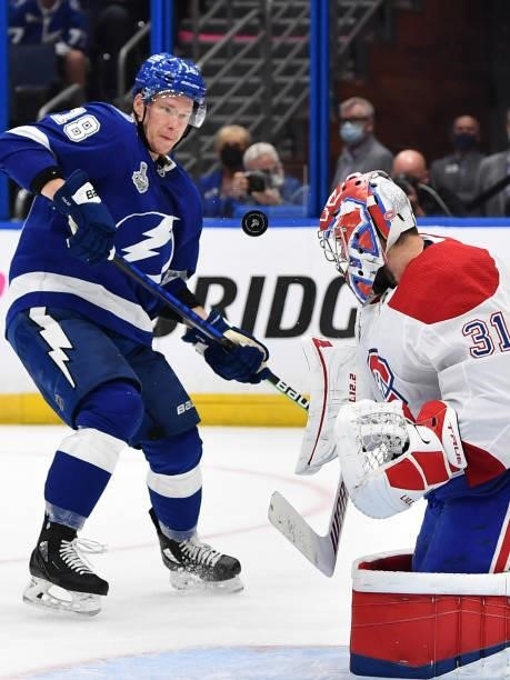 Ondrej Palat of the Tampa Bay Lightning watches the puck in front of goaltender Carey Price of the Montreal Canadiens during third period of Game One...