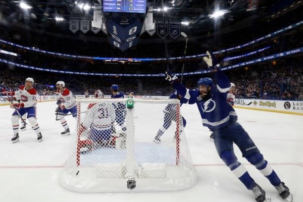 Victor Hedman of the Tampa Bay Lightning celebrates a goal by Yanni Gourde past Carey Price of the Montreal Canadiens during the third period in Game...