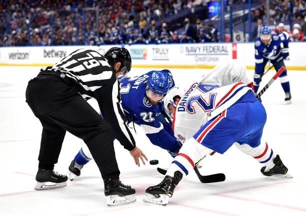 Brayden Point of the Tampa Bay Lightning faces off against Phillip Danault of the Montreal Canadiens during the second period of Game One of the 2021...