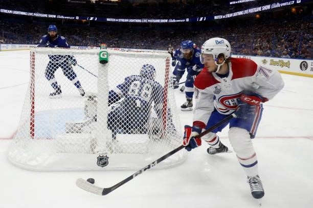Jake Evans of the Montreal Canadiens carries the puck against the Tampa Bay Lightning during the third period in Game One of the 2021 NHL Stanley Cup...