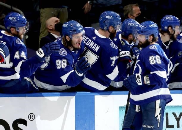 Nikita Kucherov of the Tampa Bay Lightning celebrates his goal against the Montreal Canadiens with teammate Mikhail Sergachev during the third period...