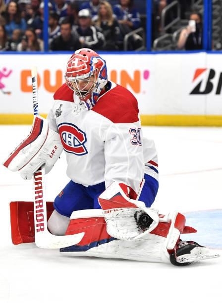 Goaltender Carey Price of the Montreal Canadiens makes a save against the Tampa Bay Lightning during the third period of Game One of the 2021 Stanley...