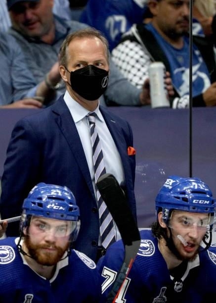 Head coach Jon Cooper watches his team play against the Montreal Canadiens in Game One of the 2021 Stanley Cup Final between the Montreal Canadiens...