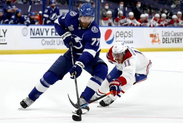 Victor Hedman of the Tampa Bay Lightning is challenged by Brendan Gallagher of the Montreal Canadiens during the second period of Game One of the...