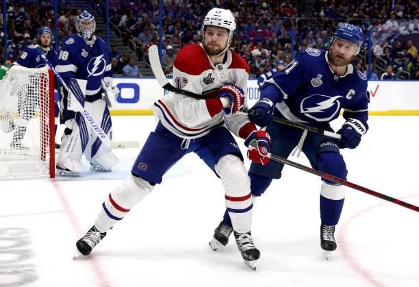Josh Anderson of the Montreal Canadiens holds the stick of Steven Stamkos of the Tampa Bay Lightning during the third period of Game One of the 2021...