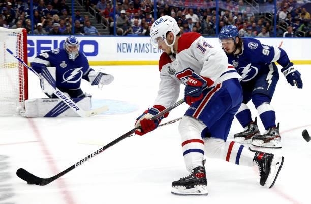 Nick Suzuki of the Montreal Canadiens controls the puck against the Tampa Bay Lightning during the third period of Game One of the 2021 Stanley Cup...