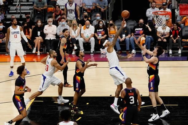 DeMarcus Cousins of the LA Clippers puts up a shot over Dario Saric of the Phoenix Suns during the first half of game five of the Western Conference...
