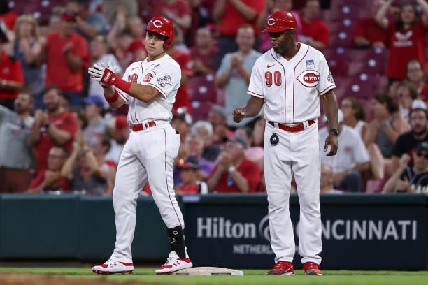 Alejo Lopez of the Cincinnati Reds celebrates after hitting a single for his first hit in Major League Baseball in the seventh inning against the...