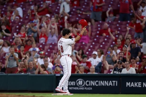 Alejo Lopez of the Cincinnati Reds acknowledges the crowd after hitting a single for his first hit in Major League Baseball in the seventh inning...