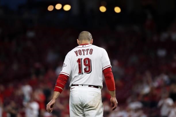 Joey Votto of the Cincinnati Reds walks across the field in the seventh inning against the Philadelphia Phillies at Great American Ball Park on June...
