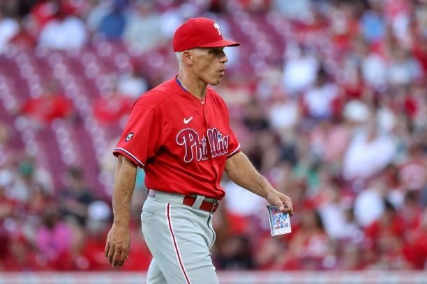 Manager Joe Girardi of the Philadelphia Phillies walks across the field in the third inning against the Cincinnati Reds at Great American Ball Park...