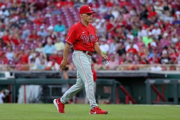 Manager Joe Girardi of the Philadelphia Phillies walks across the field in the third inning against the Cincinnati Reds at Great American Ball Park...