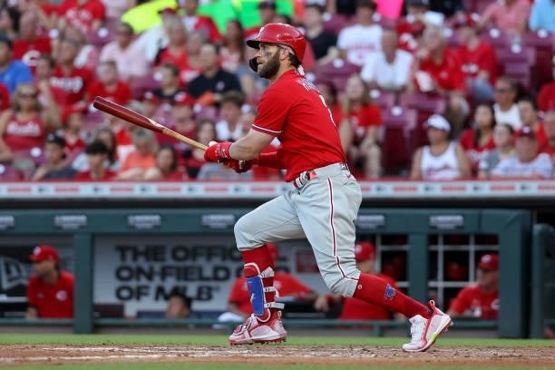Bryce Harper of the Philadelphia Phillies hits a single in the fourth inning against the Cincinnati Reds at Great American Ball Park on June 28, 2021...