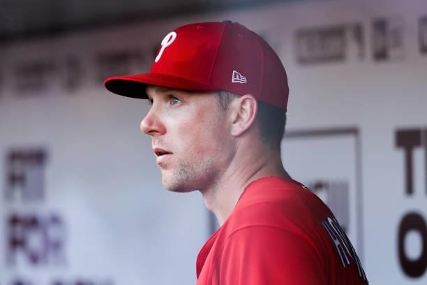 Rhys Hoskins of the Philadelphia Phillies looks on from the dugout in the fourth inning against the Cincinnati Reds at Great American Ball Park on...