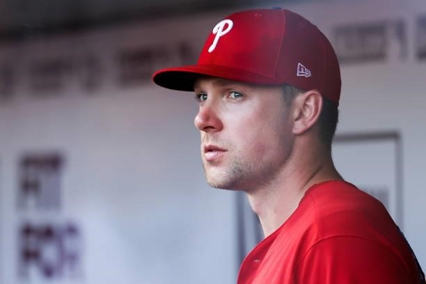 Rhys Hoskins of the Philadelphia Phillies looks on from the dugout in the fourth inning against the Cincinnati Reds at Great American Ball Park on...