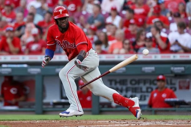 Odubel Herrera of the Philadelphia Phillies attempts a bunt in the third inning against the Cincinnati Reds at Great American Ball Park on June 28,...
