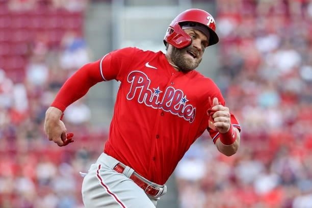 Bryce Harper of the Philadelphia Phillies runs to third base in the fourth inning against the Cincinnati Reds at Great American Ball Park on June 28,...