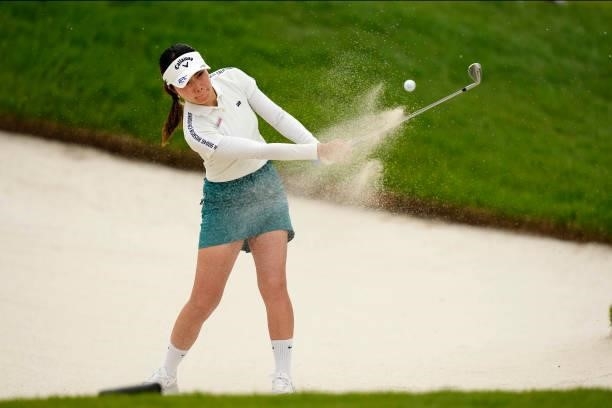 Riko Inoue of Japan hits out of a bunker on the 18th hole during the first round of the Sky Ladies ABC Cup at the ABC Golf Club on June 29, 2021 in...