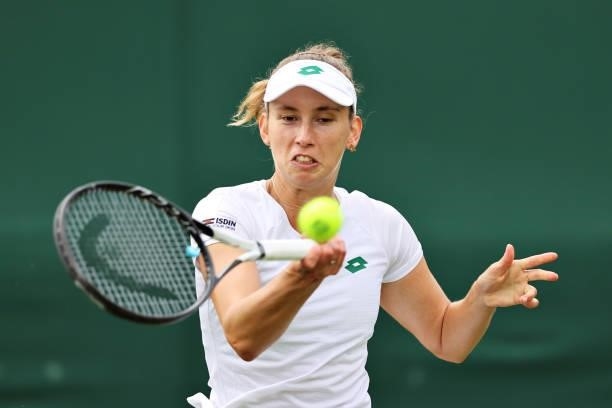 Elise Mertens of Belgium plays a forehand in her Ladies' Singles First Round match against Harriet Dart of Great Britain during Day Two of The...