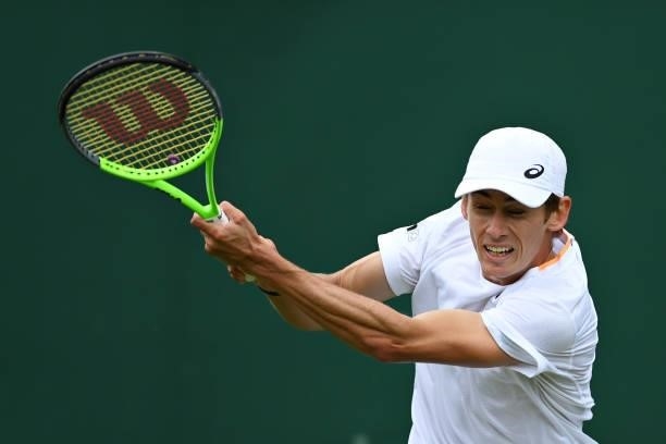 Alex de Minaur of Australia plays a backhand in his Men's Singles First Round match against Sebastian Korda of United States during Day Two of The...