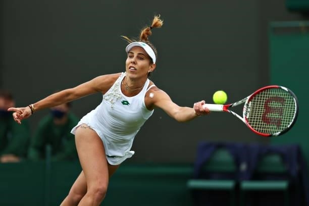 Mihaela Buzarnescu of Romania plays a forehand in her Ladies' Singles First Round match against Venus Williams of United States during Day Two of The...