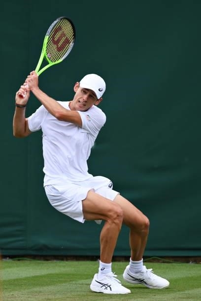 Alex de Minaur of Australia plays a backhand in his Men's Singles First Round match against Sebastian Korda of United States during Day Two of The...