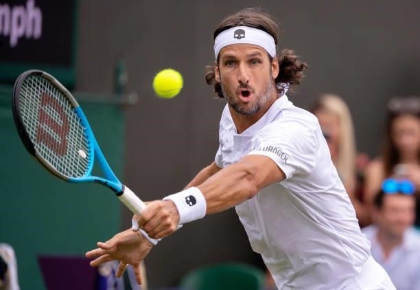 Feliciano Lopez of Spain plays a backhand in his Men's Singles First Round match against Daniel Evans of Great Britain during Day Two of The...