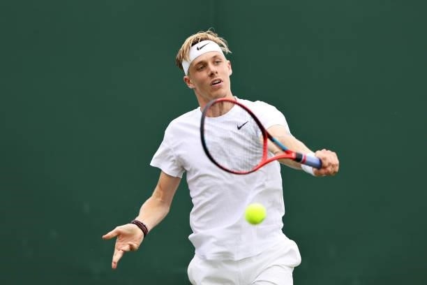 Denis Shapovalov of Canada plays a backhand in his Men's Singles First Round match against Philipp Kohlschreiber of Germany during Day Two of The...