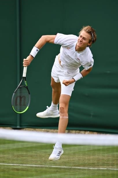 Sebastian Korda of United States serves in his Men's Singles First Round match against Alex de Minaur of Australia during Day Two of The...
