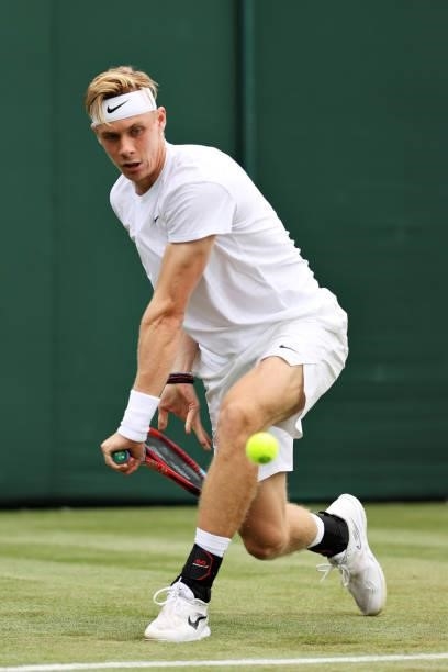 Denis Shapovalov of Canada plays a backhand in his Men's Singles First Round match against Philipp Kohlschreiber of Germany during Day Two of The...