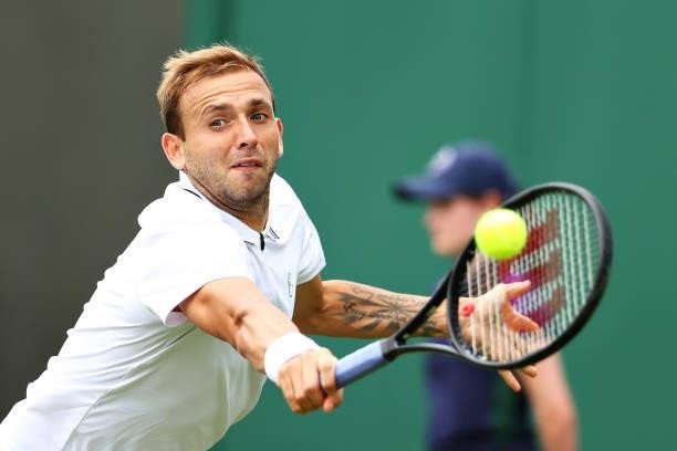 Daniel Evans of Great Britain plays a backhand in his Men's Singles First Round match against Feliciano Lopez of Spain during Day Two of The...