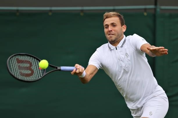 Daniel Evans of Great Britain plays a forehand in his Men's Singles First Round match against Feliciano Lopez of Spain during Day Two of The...