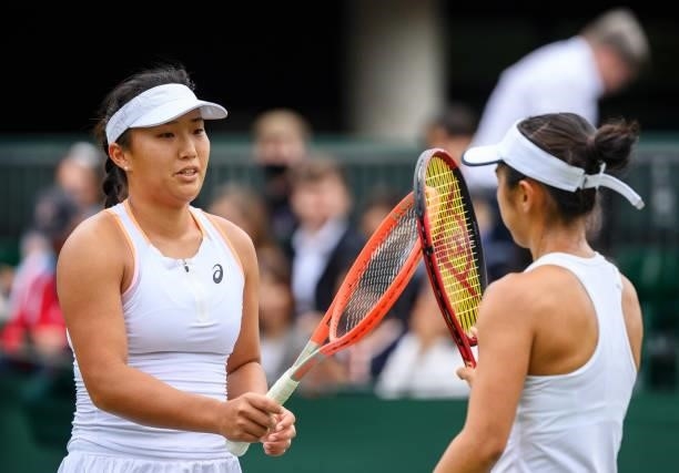 Claire Liu of United States touches rackets with Misaki Doi of Japan after the Ladies' Singles First Round match during Day Two of The Championships...