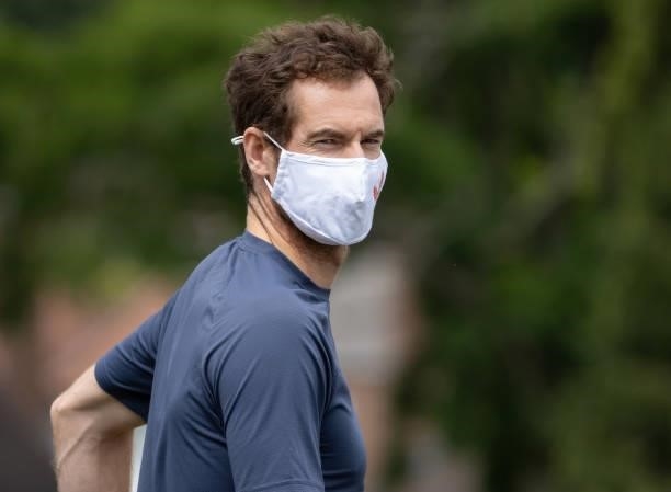 Andy Murray of Great Britain wears a face mask on the Aorangi Practice Courts during Day Two of The Championships - Wimbledon 2021 at All England...