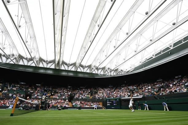 General view inside the court as Alexander Zverev of Germany serves under the roof during Day Two of The Championships - Wimbledon 2021 at All...