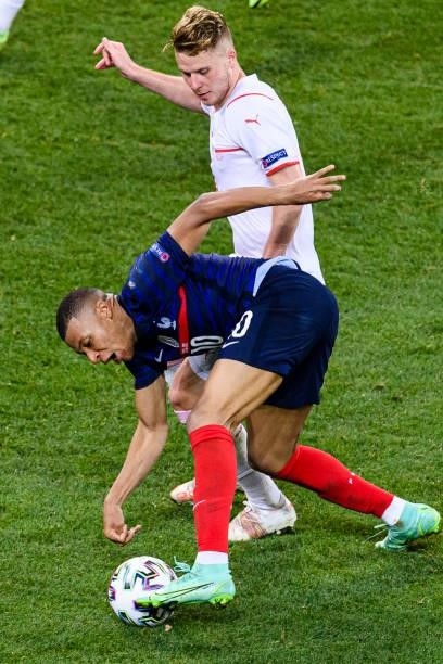 Nico Elvedi of Switzerland fights for the ball with Kylian Mbappe of France during the UEFA Euro 2020 Championship Round of 16 match between France...