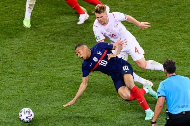 Nico Elvedi of Switzerland fights for the ball with Kylian Mbappe of France during the UEFA Euro 2020 Championship Round of 16 match between France...