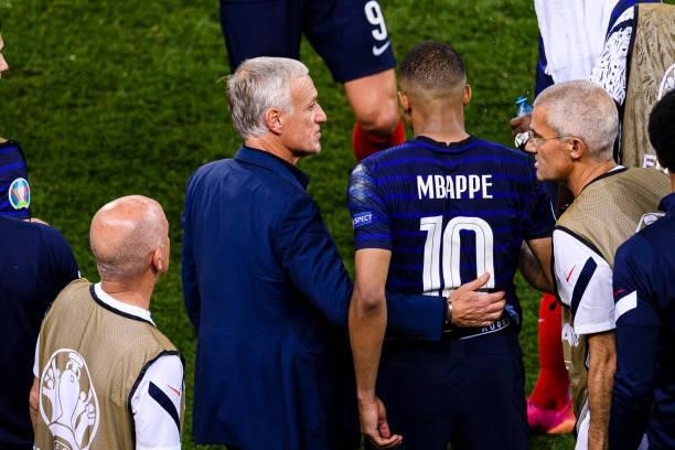 France Head Coach Didier Deschamps talks to Kylian Mbappe of France during the UEFA Euro 2020 Championship Round of 16 match between France and...