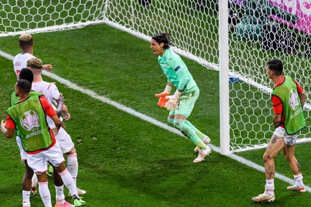 Goalkeeper Yann Sommer of Switzerland celebrating with his teammates after defending a penalty kicked by Kylian Mbappe of France during the UEFA Euro...