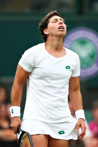 Carla Suarez Navarro of Spain reacts in her Ladies' Singles First Round match against Ashleigh Barty of Australia during Day Two of The Championships...