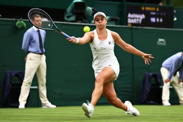 Ashleigh Barty of Australia stretches to play a forehand in her Ladies' Singles First Round match against Carla Suarez Navarro of Spain during Day...