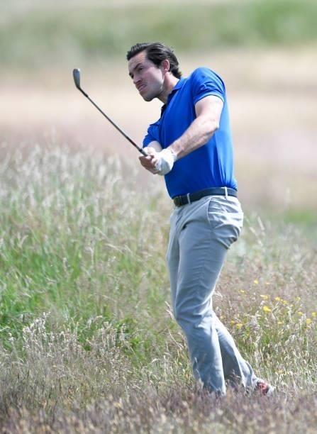 James Robinson of England plays his second shot on the 10th hole during Final Qualifying for the 149th Open at St Annes Old Links Golf Club on June...