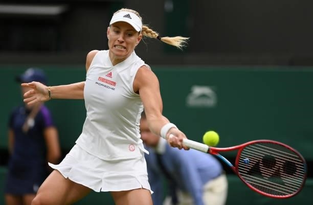 Angelique Kerber of Germany plays a forehand in her Ladies' Singles First Round match against Nina Stojanovic of Serbia during Day Two of The...